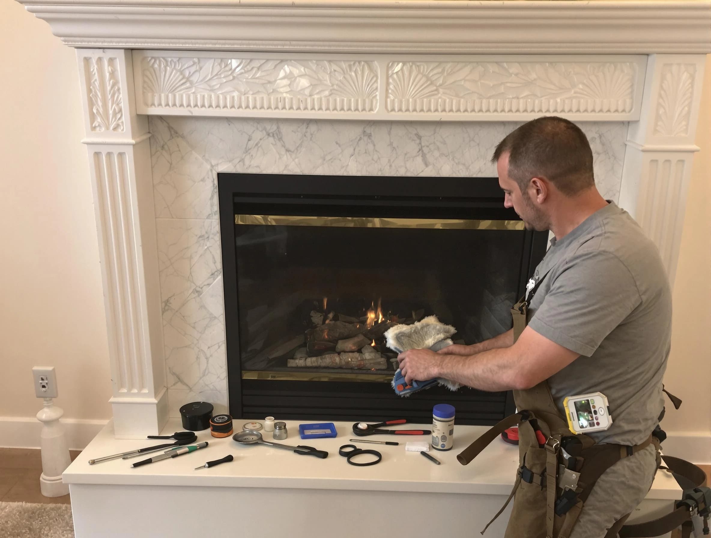 Milton Chimney Sweep performing fireplace maintenance in Milton, MA