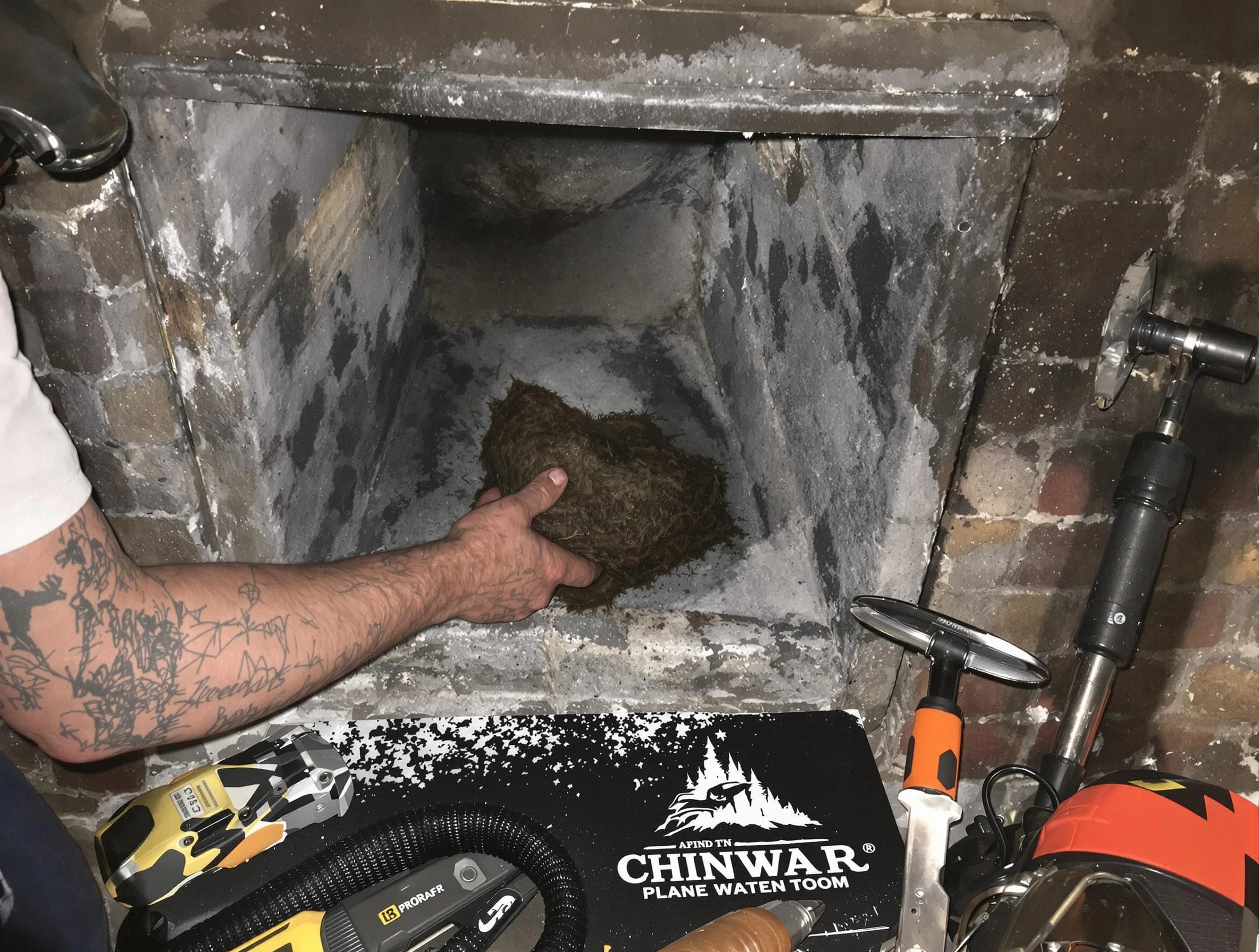 Milton Chimney Sweep safely removing debris and screening chimney in Milton, MA